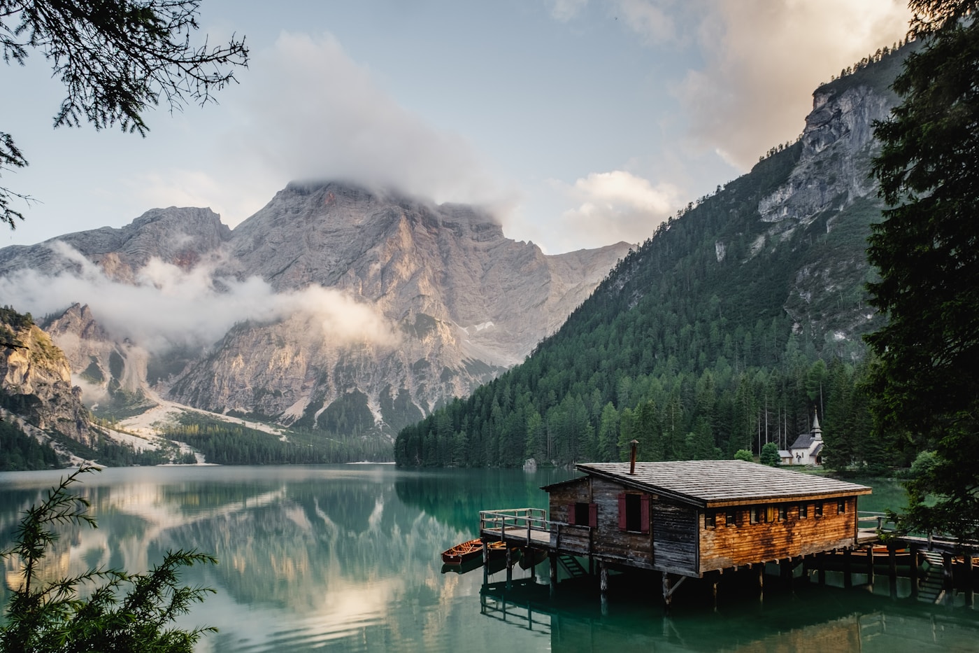 An isolated cabin and mountain landscape, suggesting a story setting